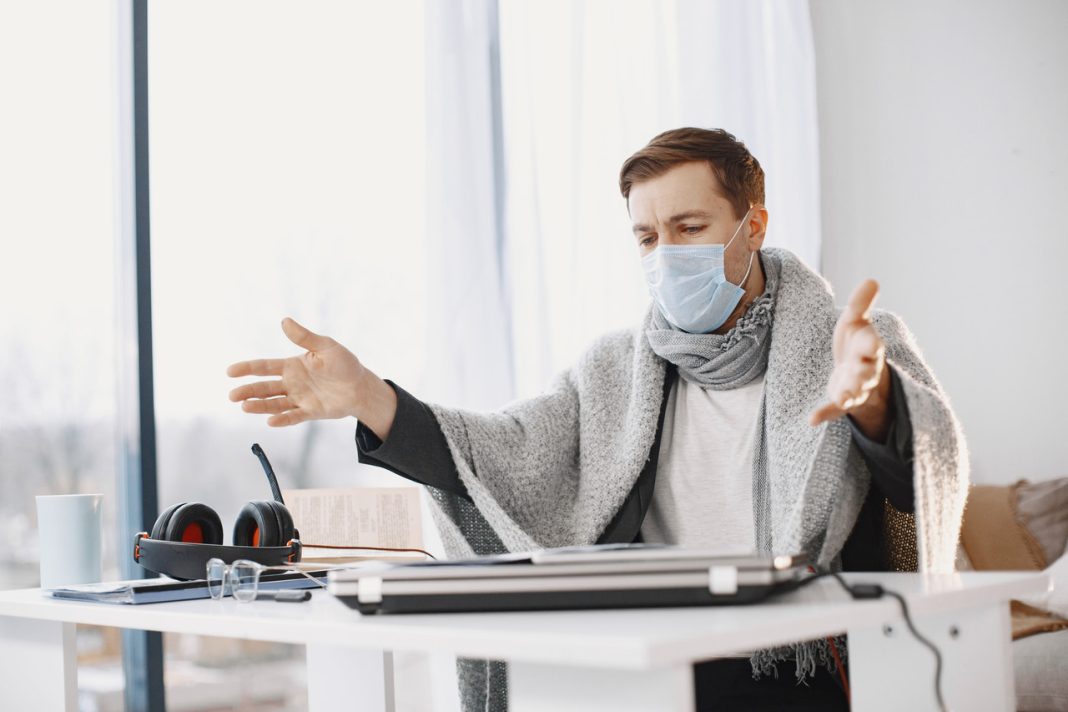 male-medical-mask-man-sitting-living-room-home-guy-enjoying-studying-quarantine